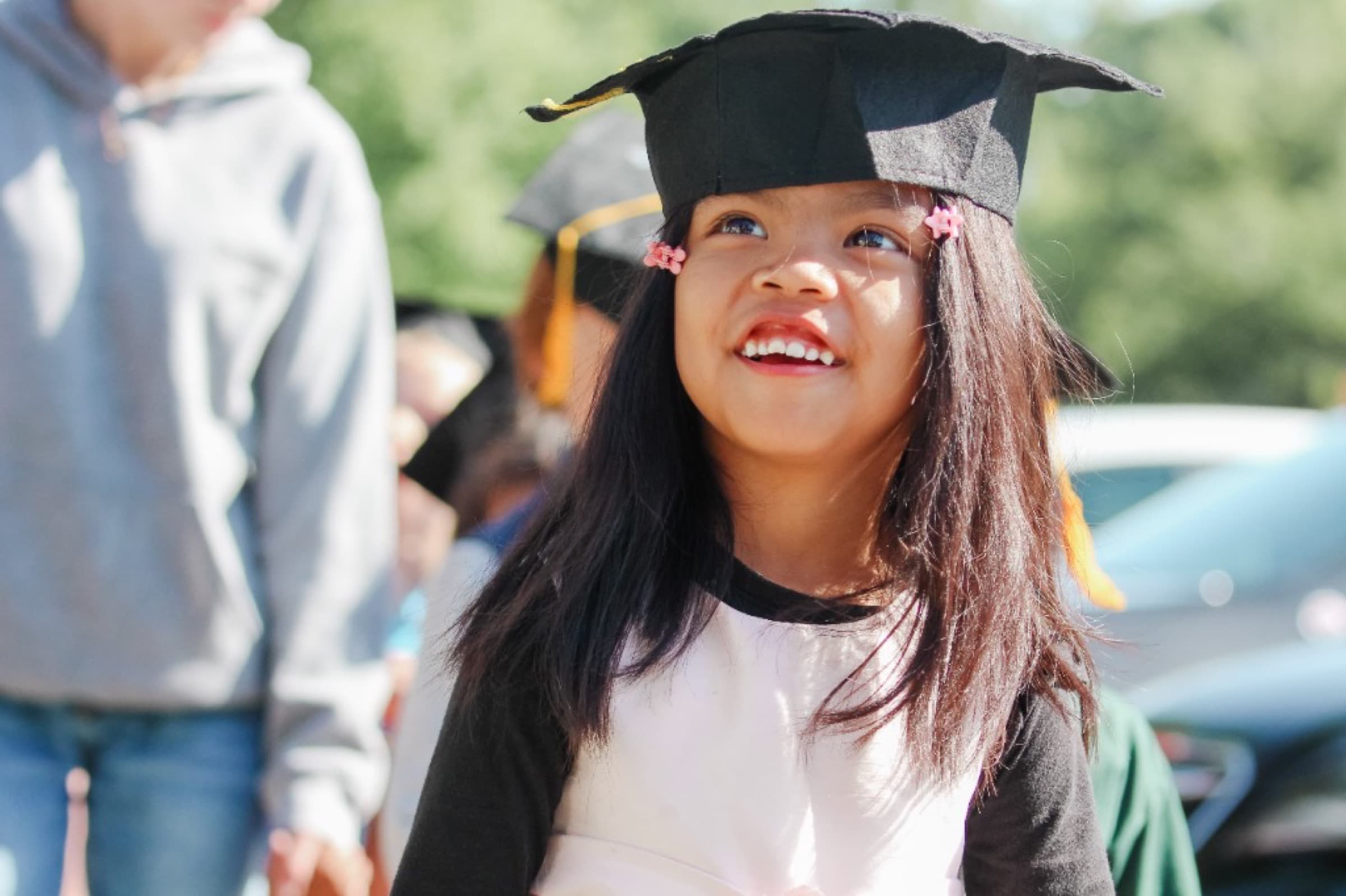 Child in a graduation cap