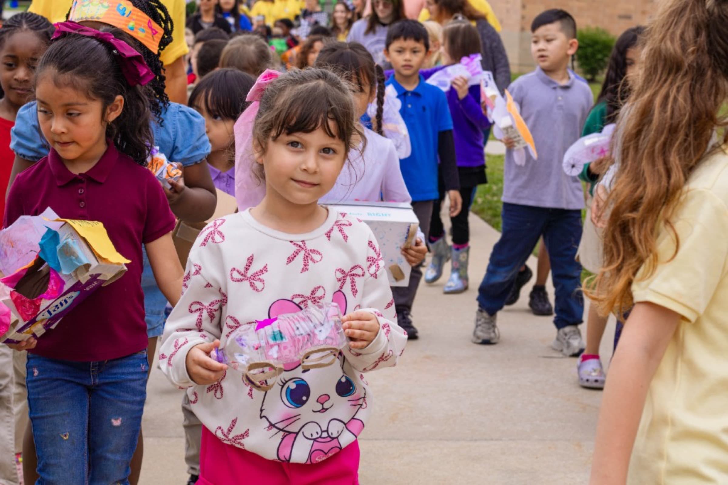 Preschool students in colorful shirts