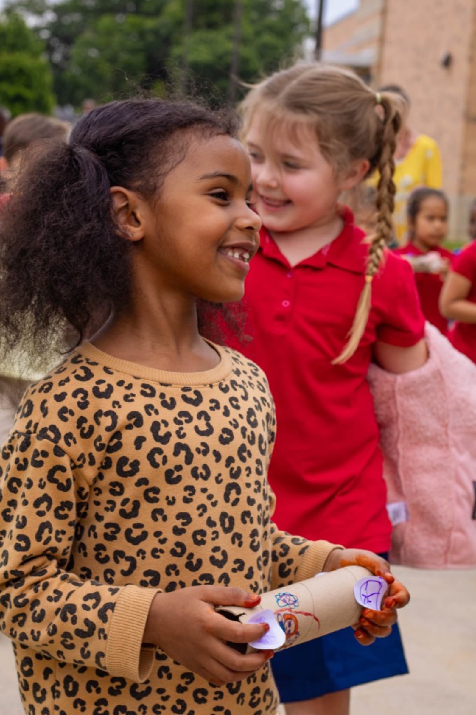Preschool students in colorful shirts