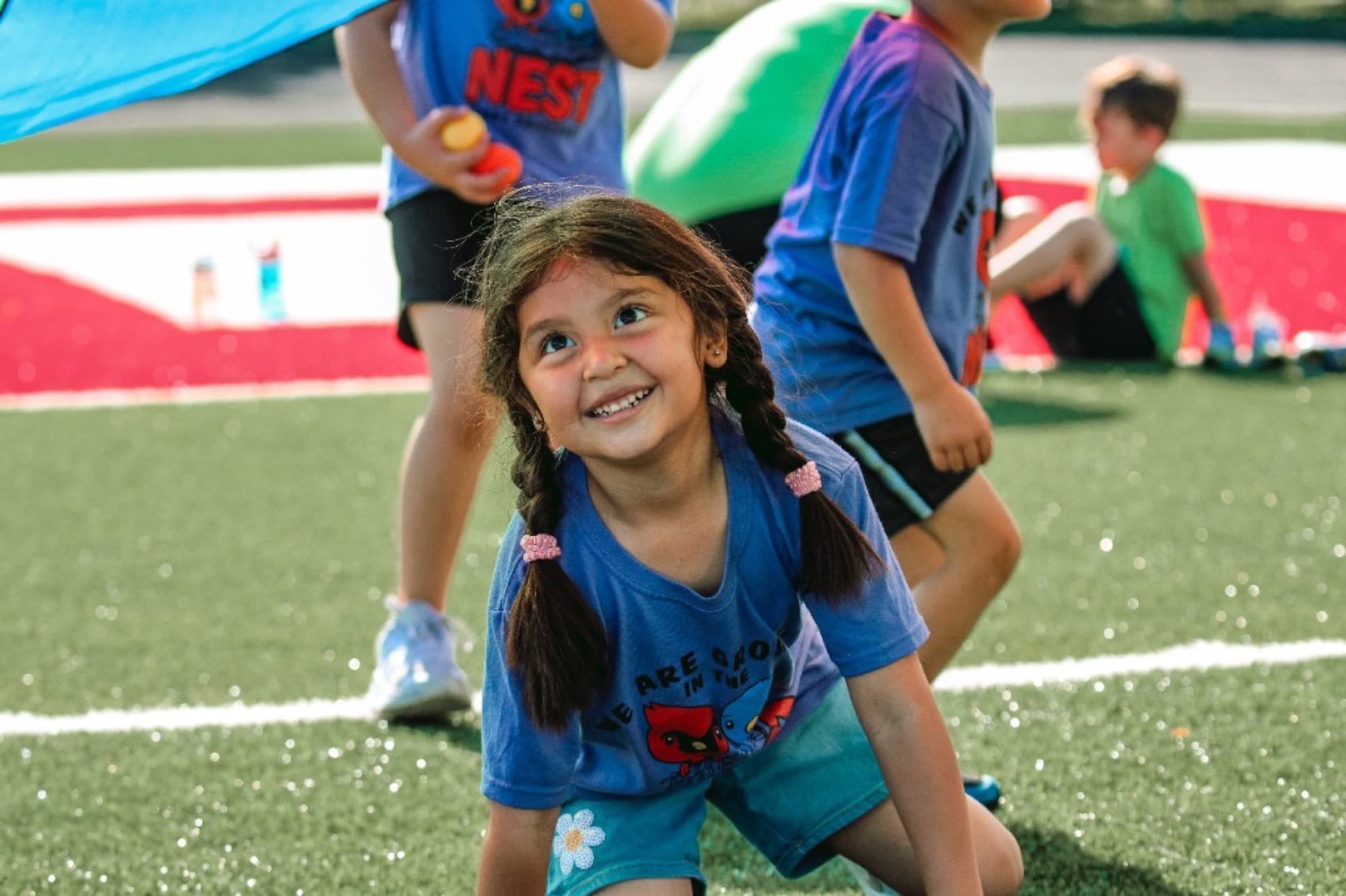 Preschool students in colorful shirts