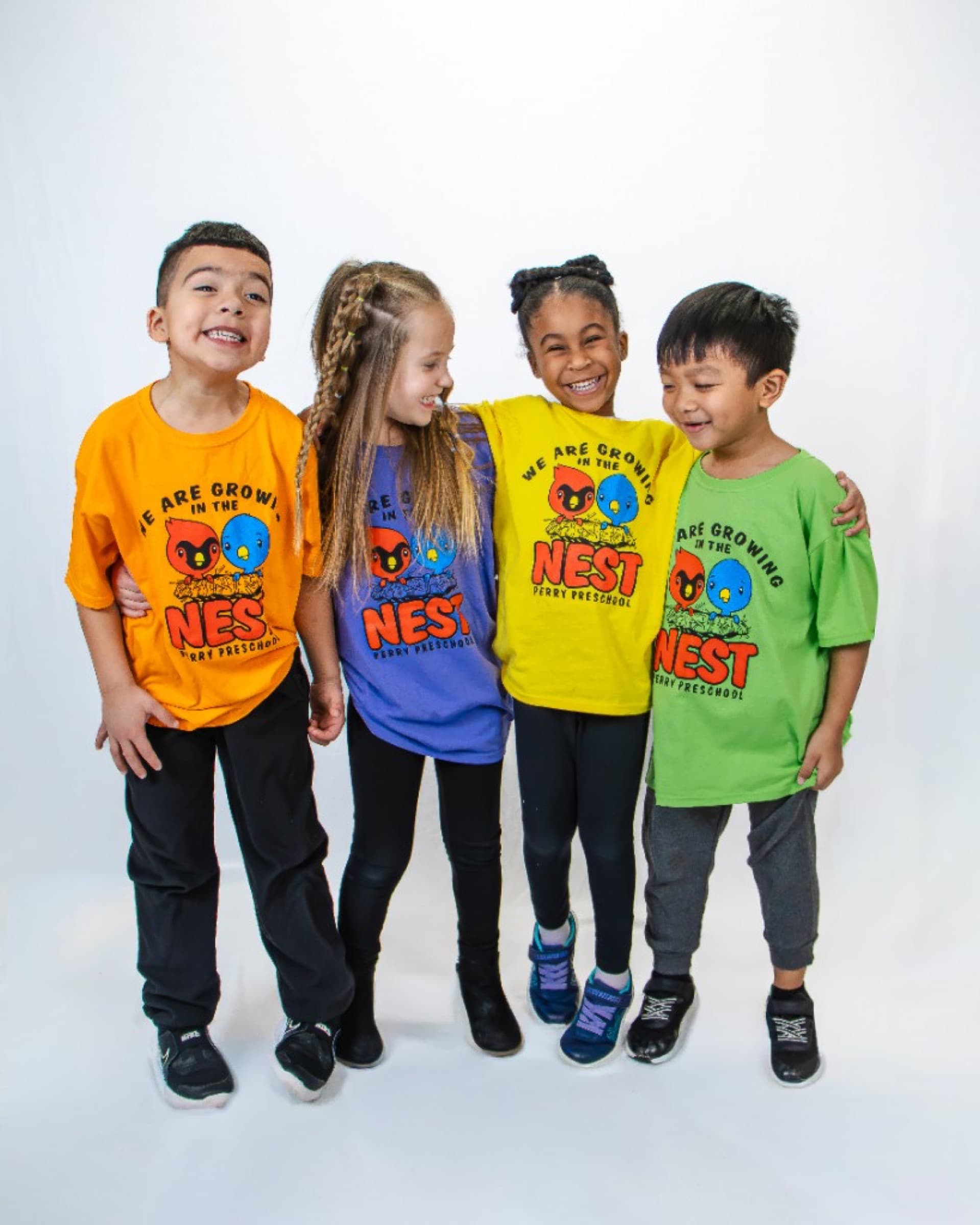 Preschool students in colorful shirts