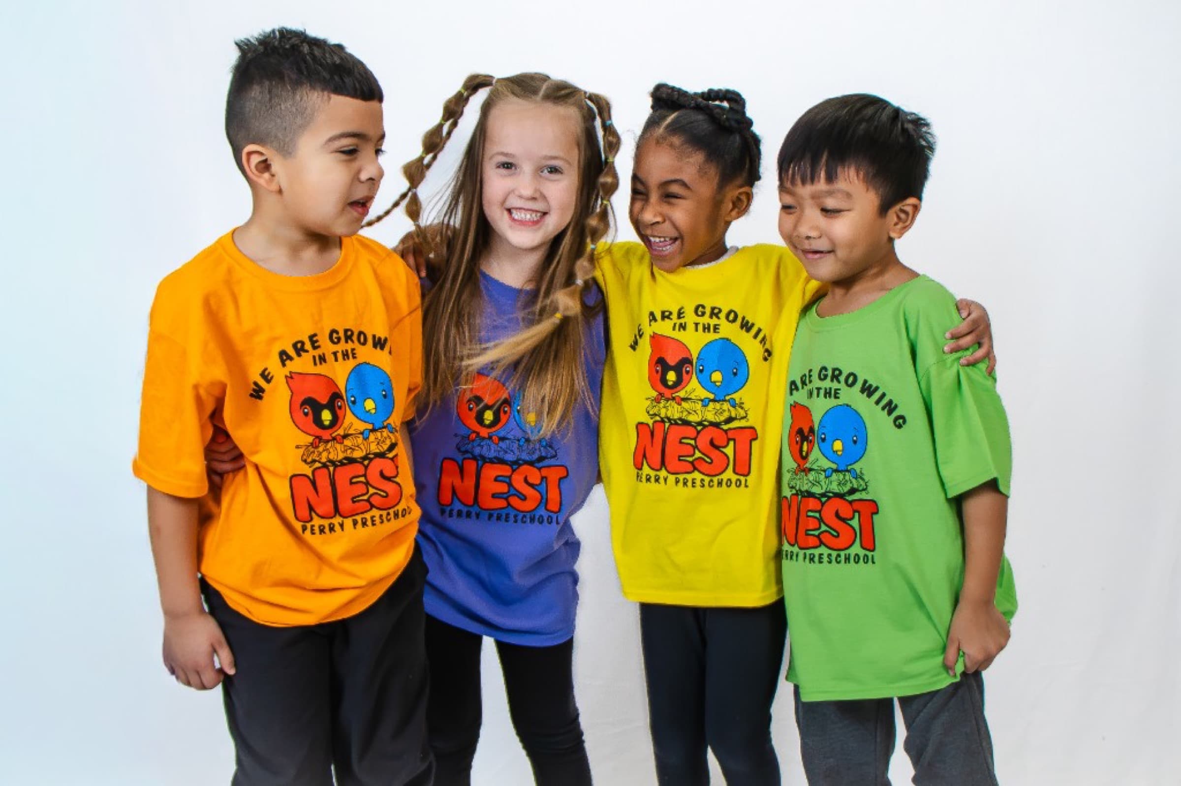 Preschool students in colorful shirts