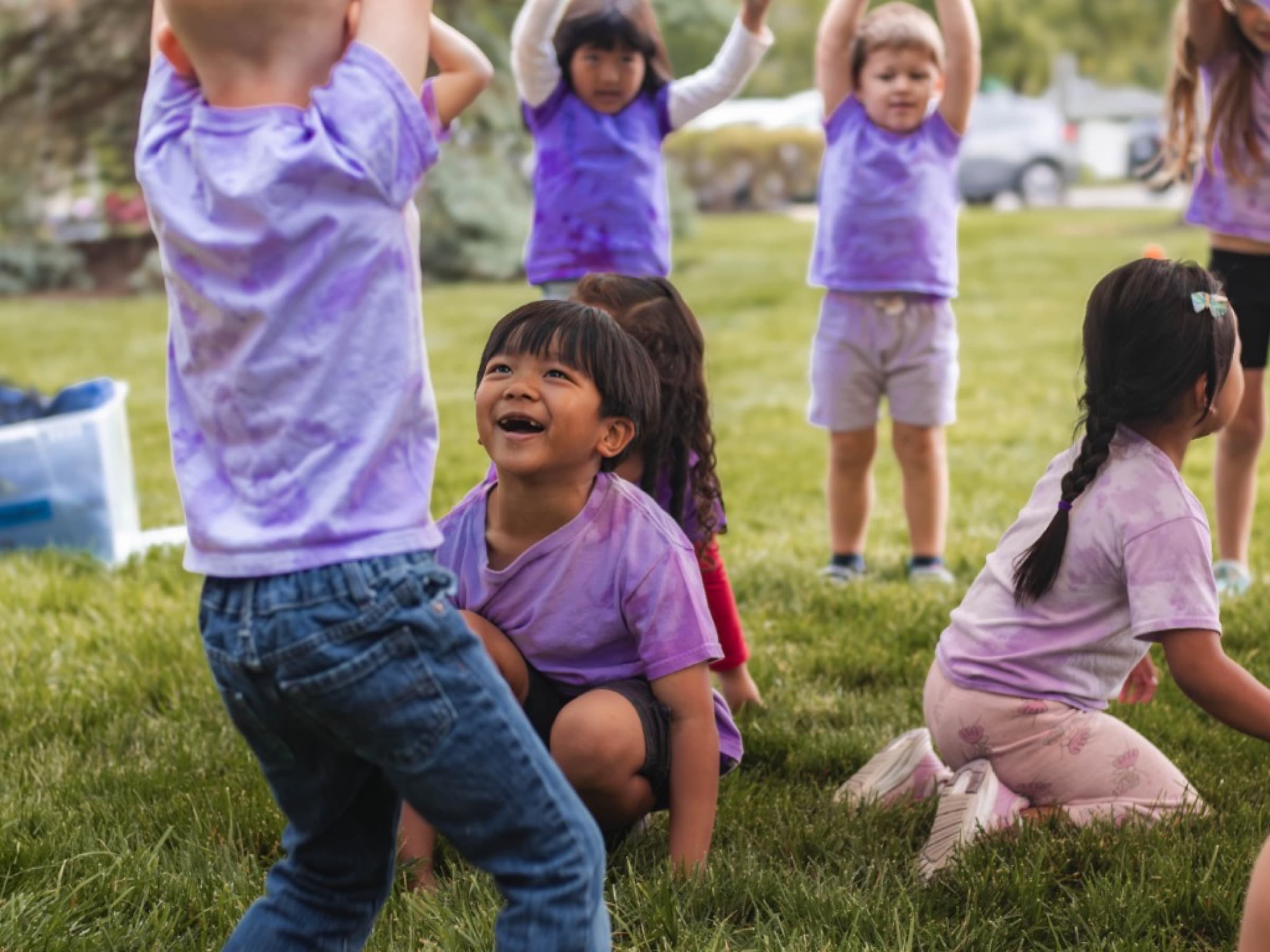 Preschool students in colorful shirts
