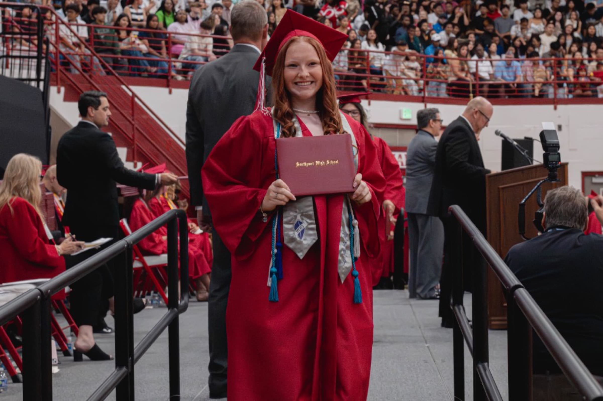 Graduate holding a diploma