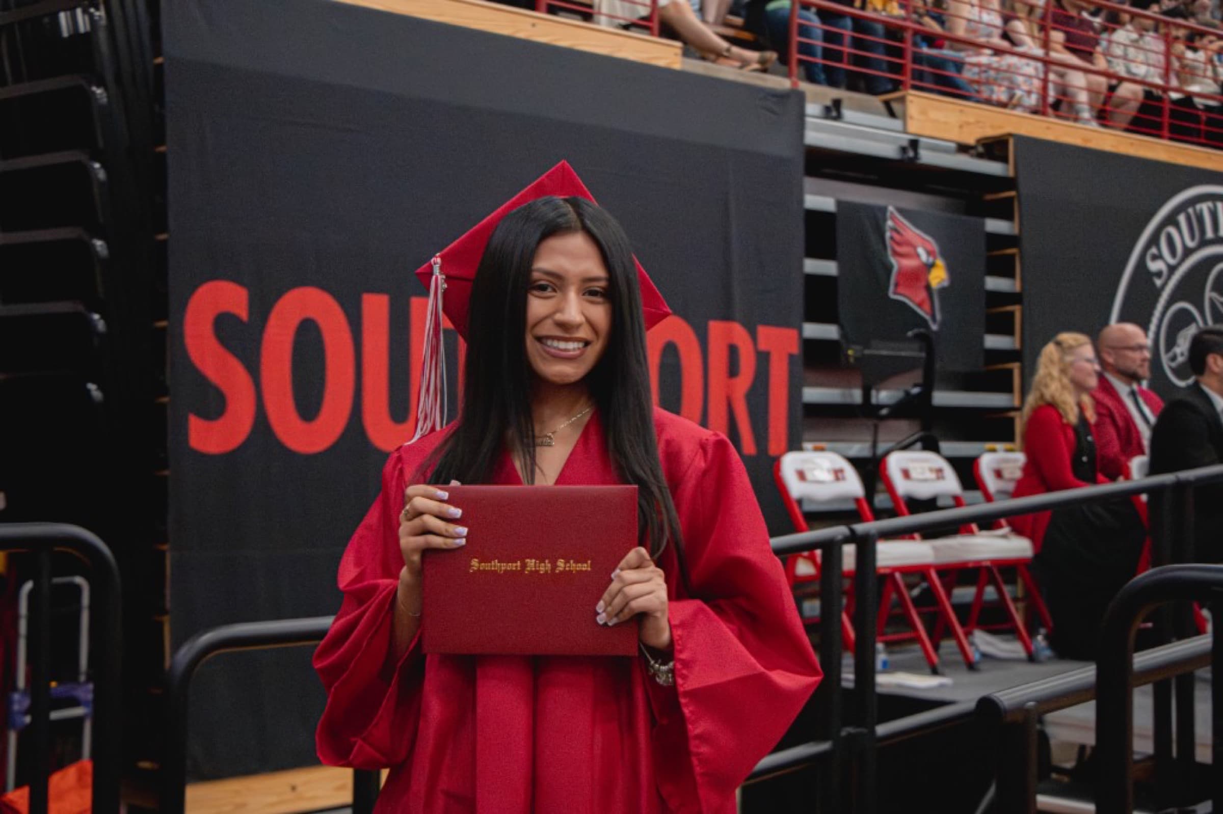 Graduate holding a diploma
