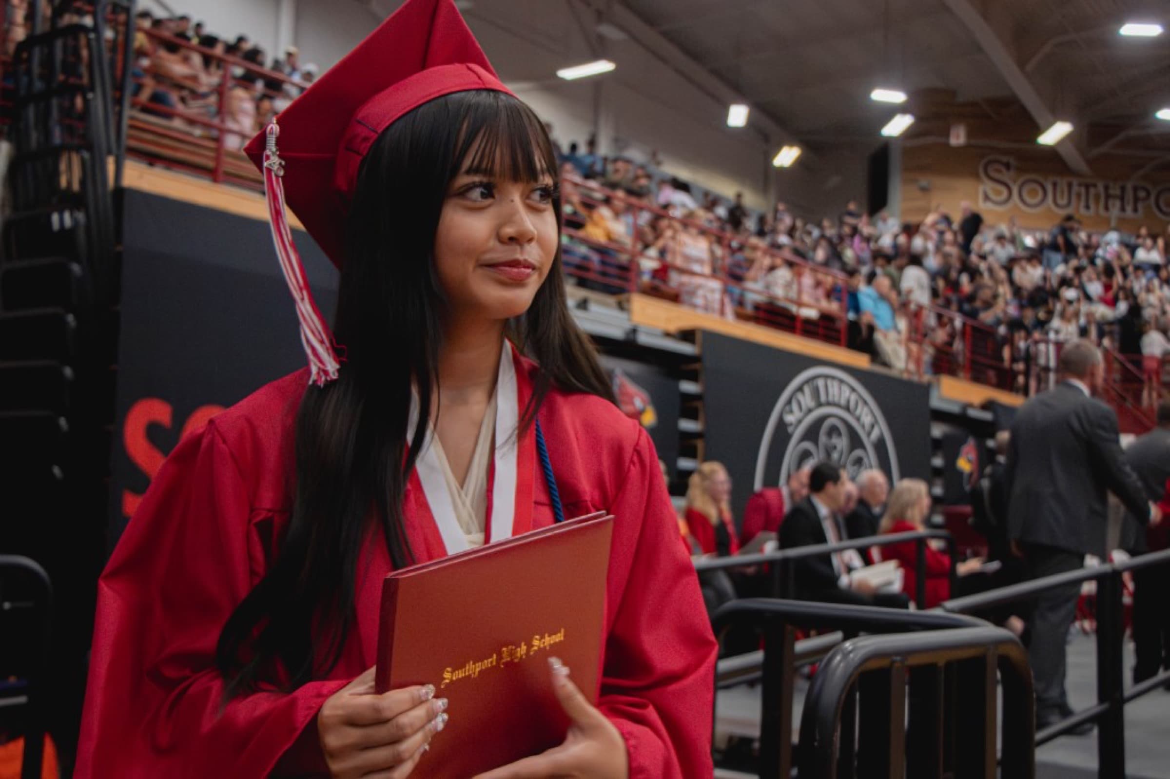 Graduate holding a diploma
