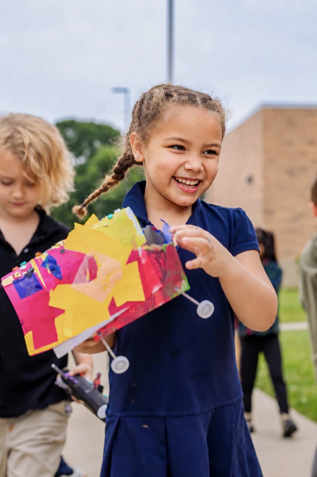Student holding a handmade project