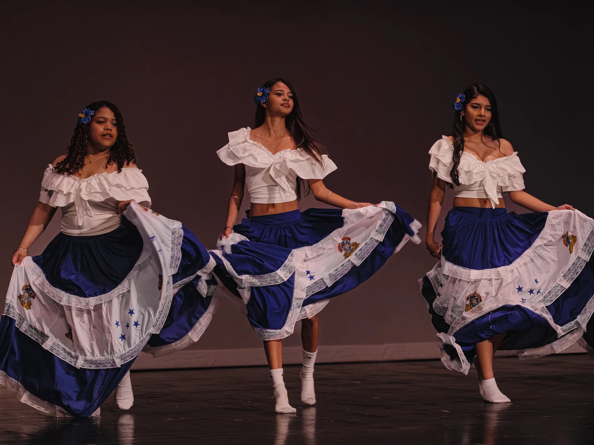 Student performers dancing on stage