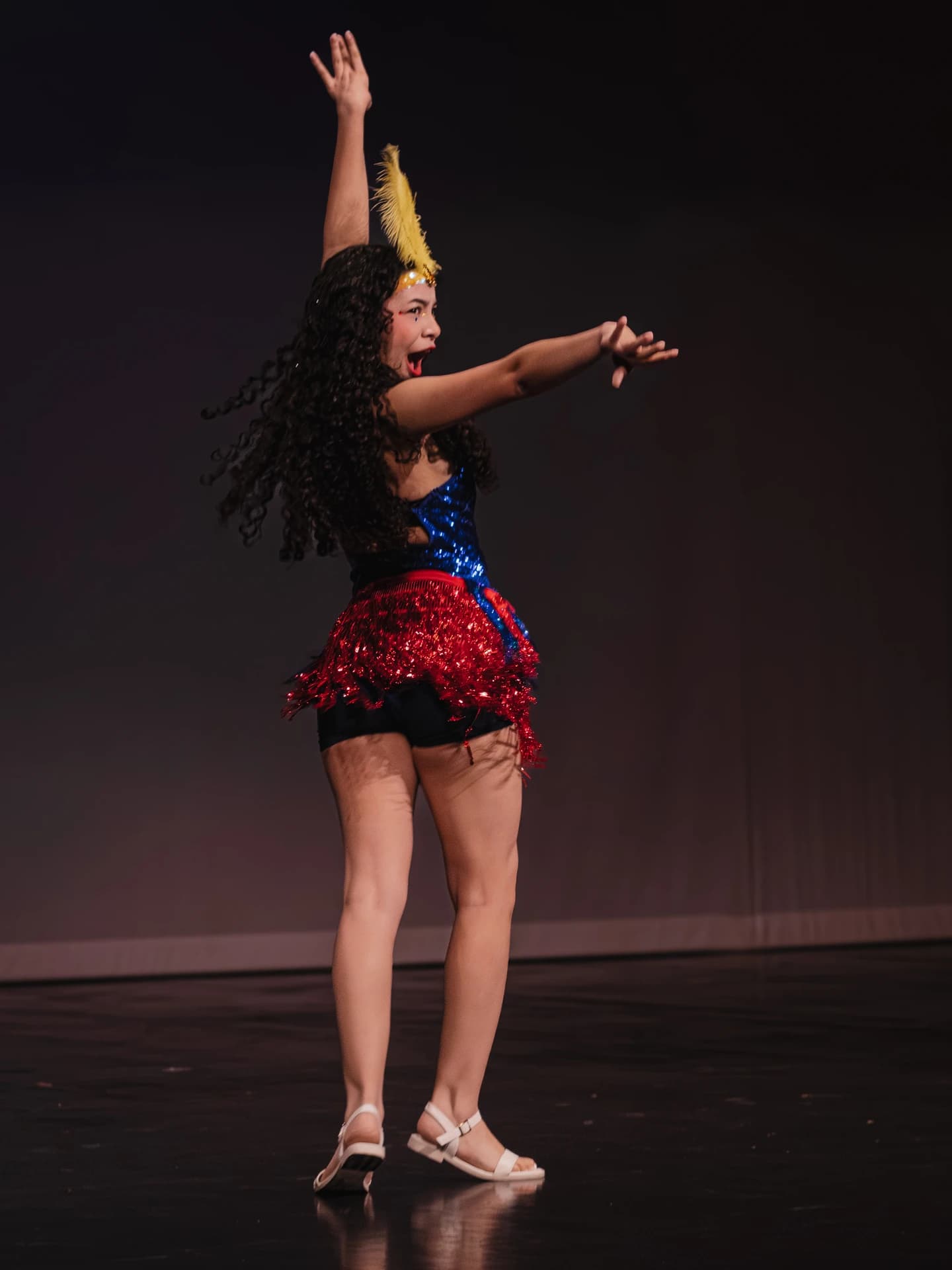 Student performer dancing on stage