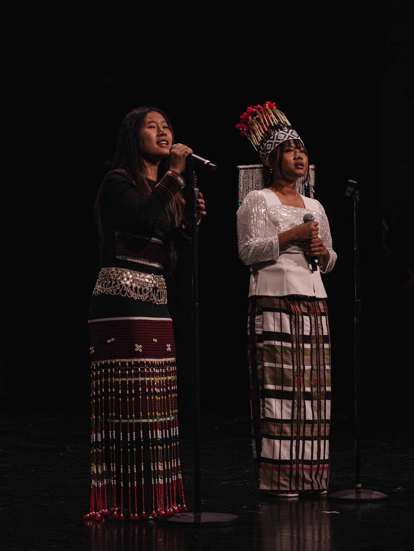 Student performers singing on stage