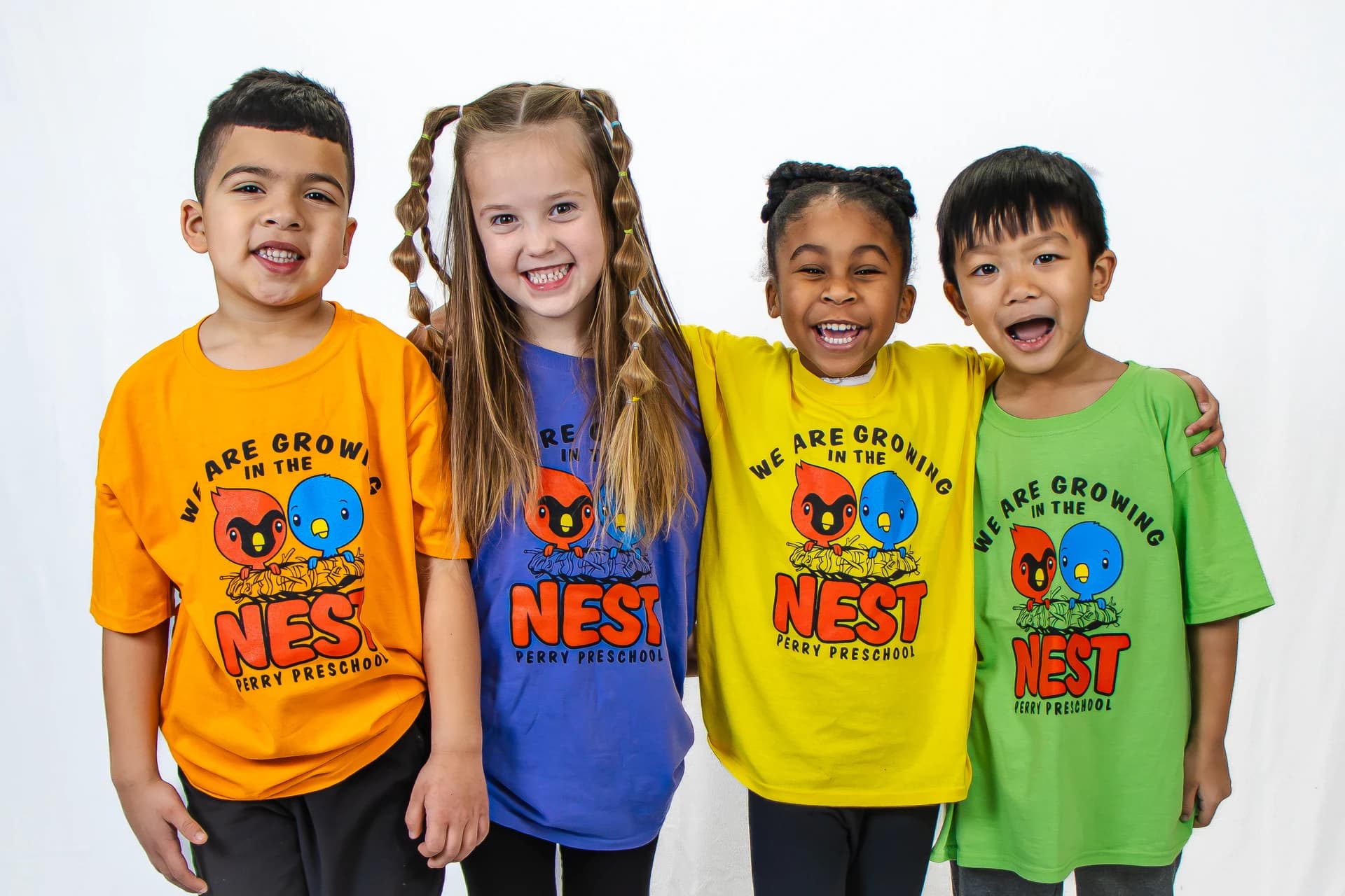 Preschool students in colorful shirts
